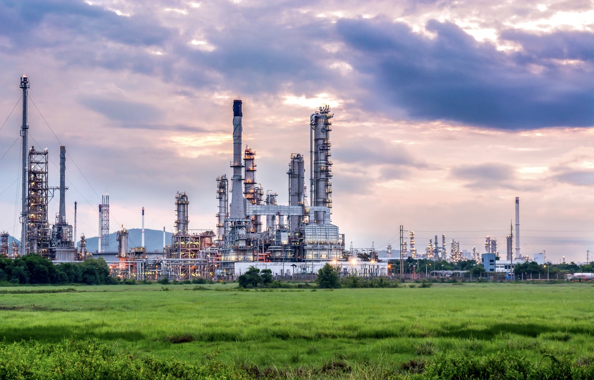Oil and gas industry refinery at sunset