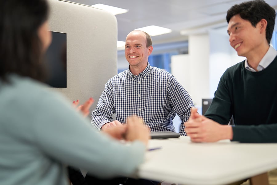 Johnson Matthey employees discussing around a table
